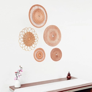 Set of five natural handmade rattan wall decors in various sizes and woven patterns