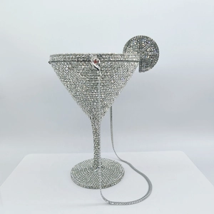 Macro detail of silver martini glass clutch bag featuring luxury crystal rhinestones