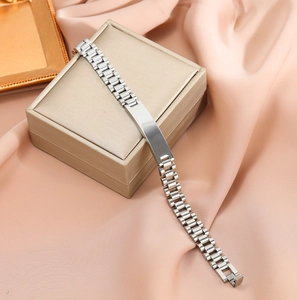 Elegant silver stainless steel watch band style bracelet on a premium jewelry box