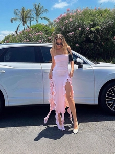 Pink strapless tube dress with ruffled hem and high slit for summer beach vacation