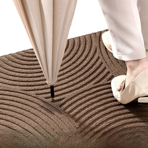 Macro shot of brown non-slip floor mat showing wave texture and high water absorption