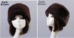 Detail view of thick dark brown plush faux rabbit fur hat for winter warmth