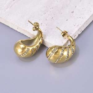 Elegant gold drop earrings with micro-inlaid rhinestones on a marble stone display