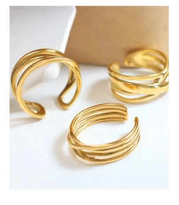 Detailed shot of gold-plated multi-layer intertwined coil ring with adjustable band