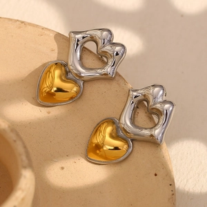 Modern two-tone heart stud earrings in gold and silver finish with liquid metal texture