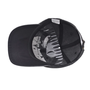 Detailed interior of vintage cotton baseball cap showing sewing lines and care label