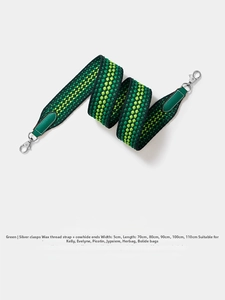 Detail of 5cm wide green woven strap with forest green leather ends and silver lobster clasp