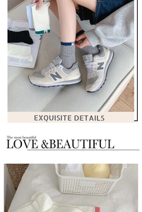 Detail of grey knitted crew socks featuring contrasting color cuffs and fabric labels
