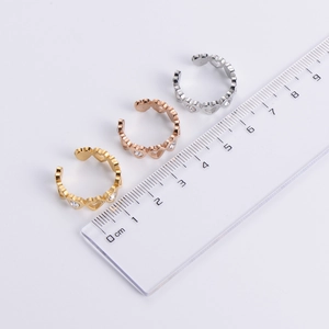 Three open heart rings in gold, rose gold and silver with cubic zirconia and ruler for size
