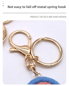Macro detail of golden metal spring clasp and handmade woven cotton keychain texture