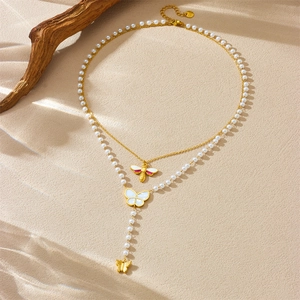 Double-layered gold-plated necklace with pearls, mother-of-pearl butterfly and bee charms