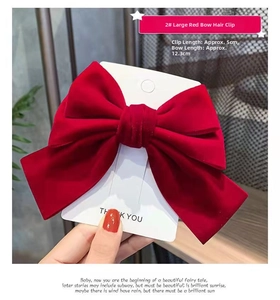 Detail view of large red velvet bow hair clip for girls with 5cm metal fastener