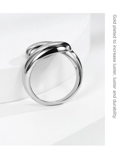 Detailed macro view of silver water drop ring showing gold plated luster and durability