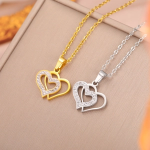 Polished stainless steel double heart pendant necklace set with shimmering rhinestones