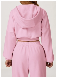Rear view of pink hooded sweatshirt and jogger set with ribbed cuffs and hem