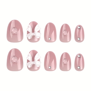 Set de faux ongles roses avec nœuds blancs 3D, cœurs en cristal et strass brillants