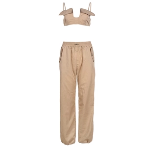 Detail of khaki two-piece set featuring a cropped camisole top and drawstring joggers