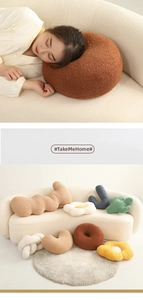 Detailed view of various plush flower and knot pillows in soft boucle fabric textures