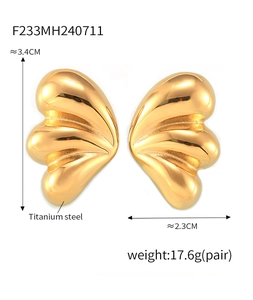 Macro view of gold butterfly wing earrings with detailed dimensions and metal weight