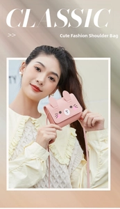 Detailed close-up of a pink rabbit-shaped mini crossbody bag with 3D ears and PU texture