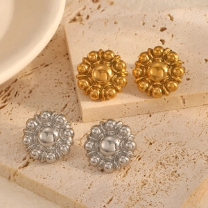 Vintage floral titanium steel stud earrings in gold and silver finish on stone