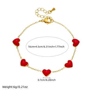 Gold stainless steel chain bracelet with five red heart charms on white background