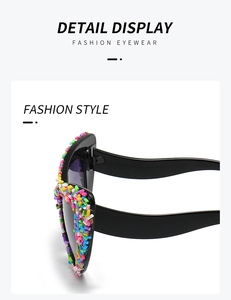 Detailed macro view of black cat-eye sunglasses featuring colorful candy bead accents