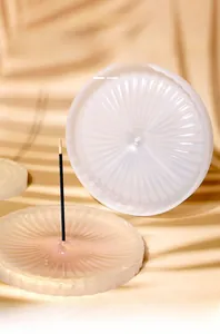 Detailed view of round silicone incense tray mold with radial wave textures for DIY crafts