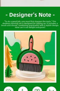 Close-up of mini desktop broom and dustpan set featuring a creative watermelon design