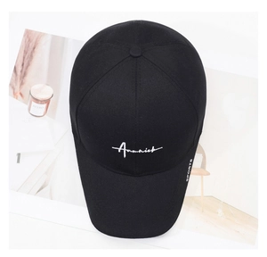 Detailed embroidery of white Ammick lettering on a black cotton twill baseball cap