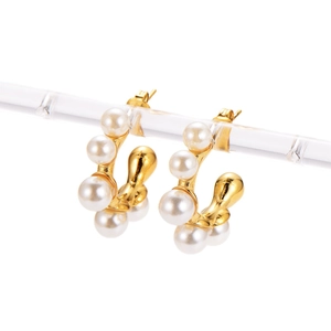 Gold-plated C-shaped hoop earrings featuring multiple white pearls on a white background