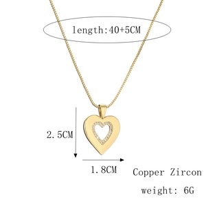 Detail view of heart pendant necklace with dimensions and copper zircon material info