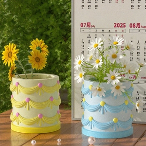 Detailed relief ribbon flower cylinder resin mold shown as a finished decorative pot