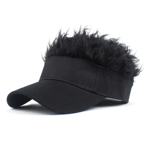 Close-up of black baseball cap with creative synthetic wig hair on a white background
