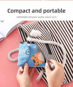 Blue canvas sanitary pad bag featuring orange cat print and convenient portable design