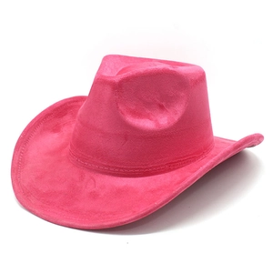 Detail of rose pink faux suede cowboy hat with curved brim and matte finish texture