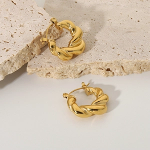 Detail view of twisted texture on gold-plated stainless steel hoop earrings for women