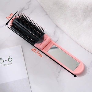 Pink foldable massage hairbrush with built-in mirror, 20.7cm length fully expanded