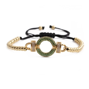 Adjustable black rope bracelet with gold beads and green zircon circle center