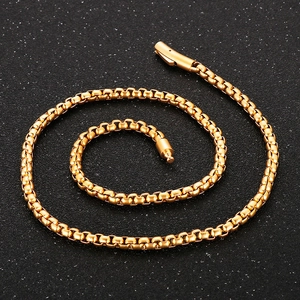 Detailed top view of 6mm golden box chain necklace with smooth fold-over clasp closure