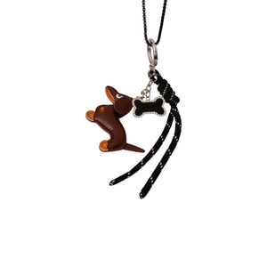 Brown leather dachshund puppy pendant necklace with rhinestone bone and woven strap