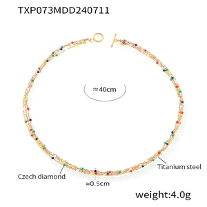 Detail of colorful beads and gold titanium steel multi-layer necklace with OT clasp