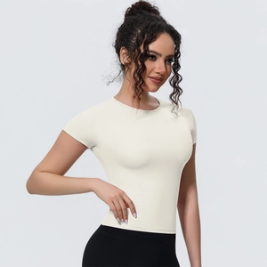 Detail view of cream slim fit yoga t-shirt showing breathable fabric and crew neck design