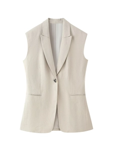 Detail of a beige sleeveless suit vest featuring a lapel collar and single-button closure