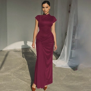 Close-up of the elegant waist pleats on a burgundy slim fit sleeveless maxi dress