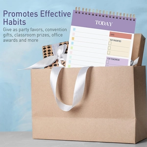 Detail of colorful daily planner spiral notebook showing daily habit tracking layout