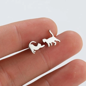 Minimalist silver cat earrings featuring cute stretching and standing feline silhouettes