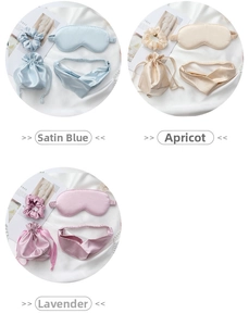 Detailed set of silk sleep masks and hair scrunchies in blue, apricot, and taro purple