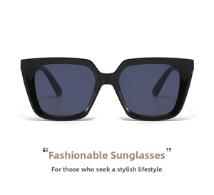 Front view of large square black sunglasses with glossy frames and dark gray lenses