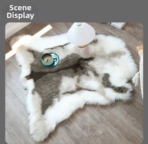 Macro detail of irregular faux fur rug with white and grey wolf-style plush texture